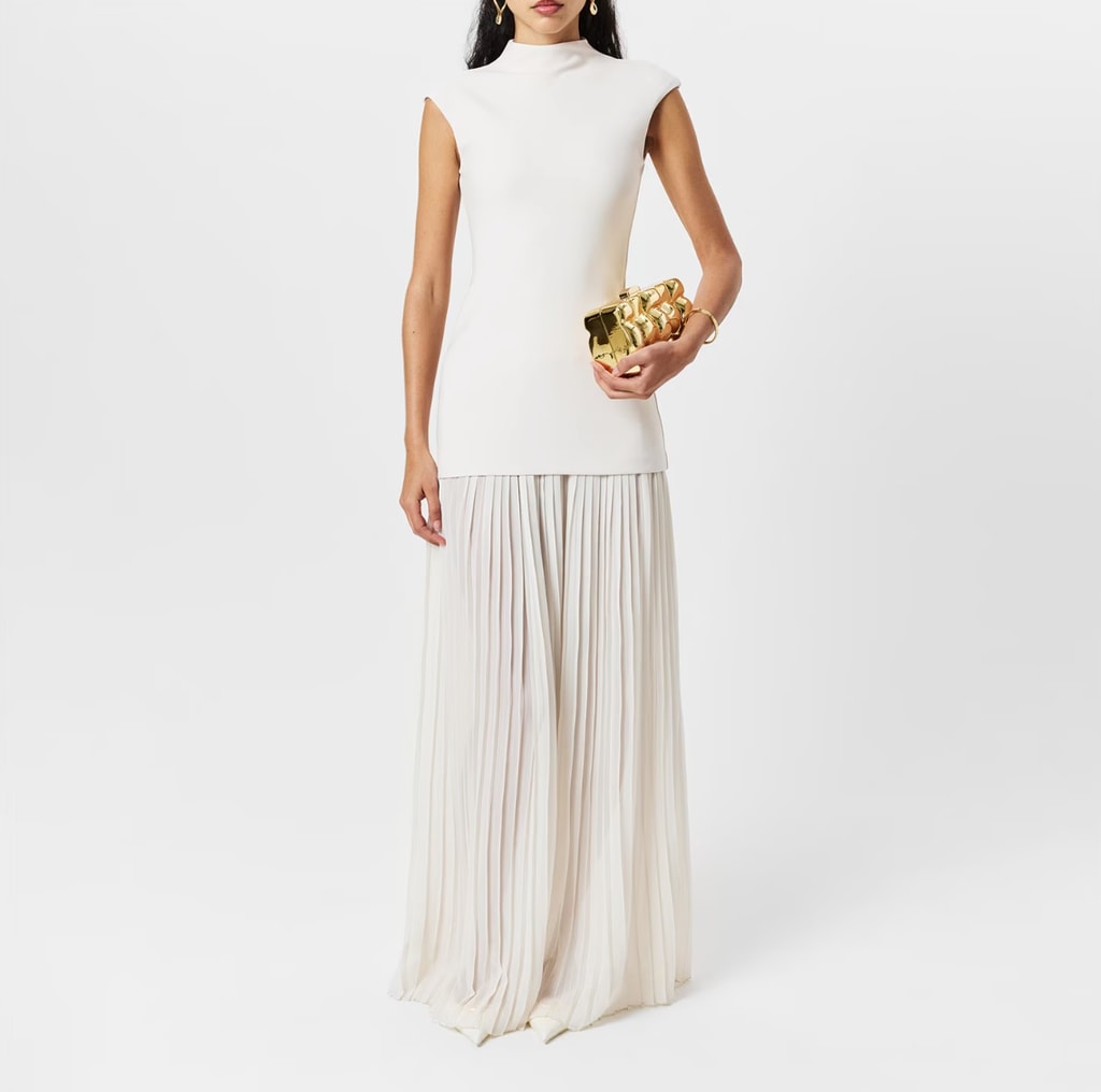 model in ivory pleated maxi dress by Naked Wardrobe