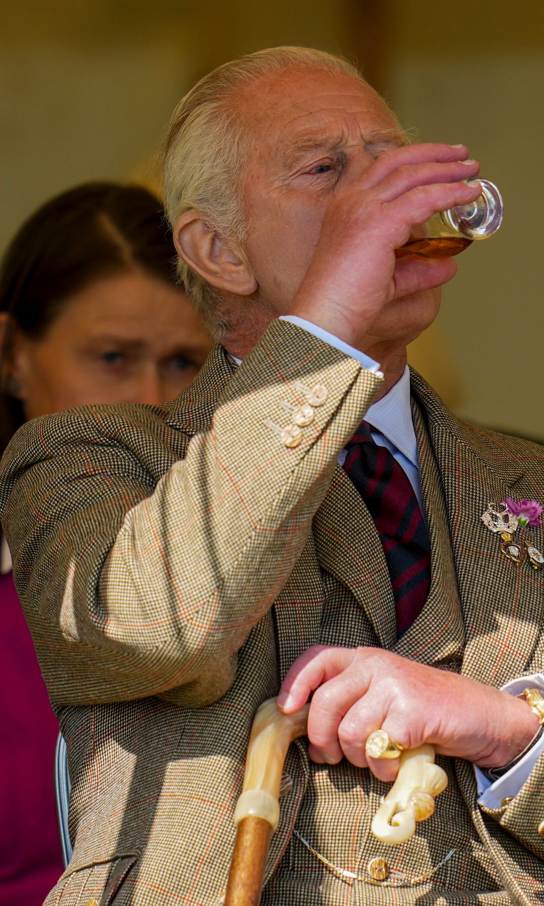 King Charles drinking whisky
