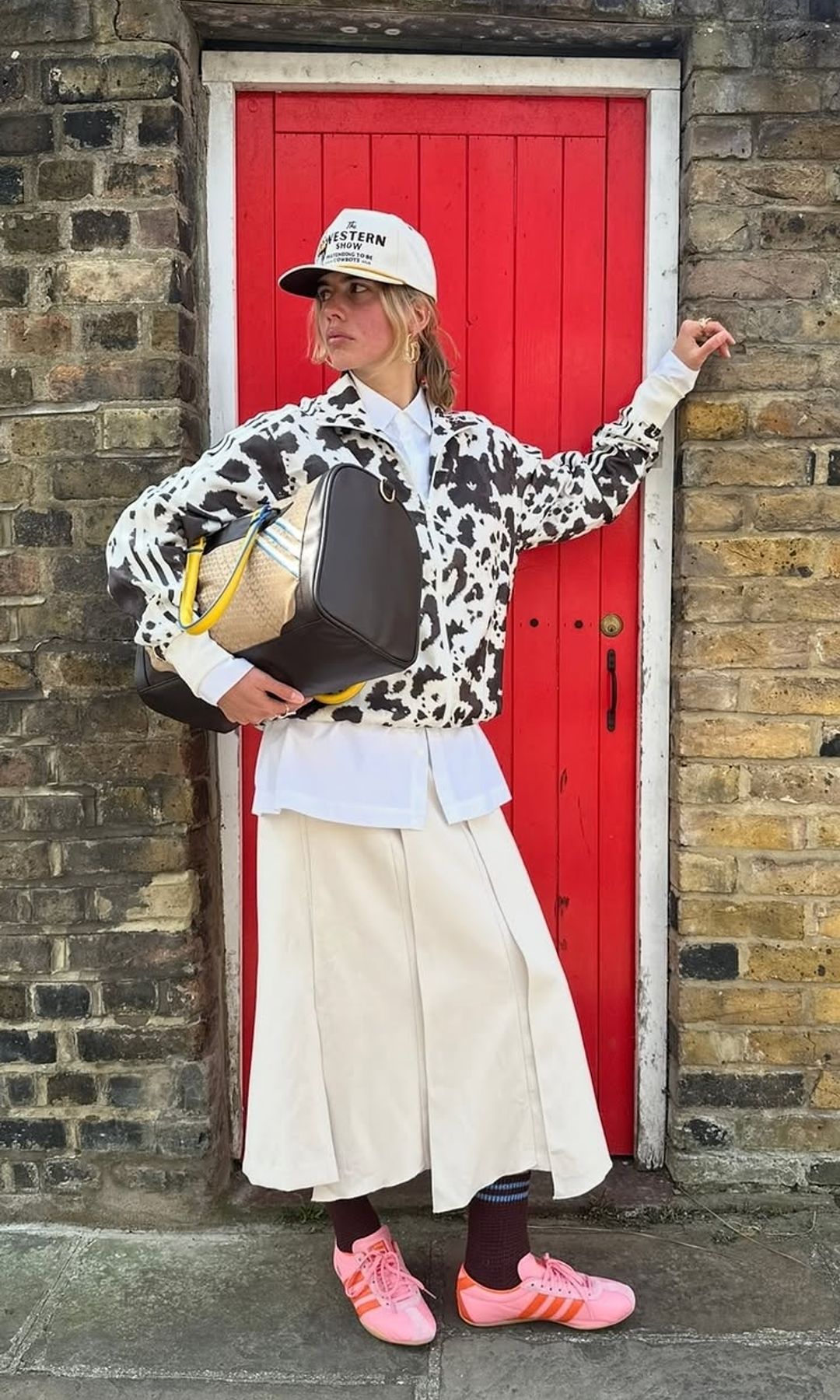 influencer wearing cow print jacket and skirt