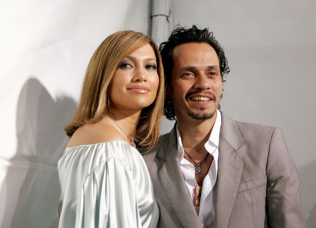 WESTWOOD, CA - APRIL 29:  Actress Jennifer Lopez (L) and her husband musician Marc Anthony arrive at New Line Cinema's Premiere of "Monster In Law" at the Mann National Theatre on April 29, 2005 in Westwood, California.  (Photo by Kevin Winter/Getty Images)