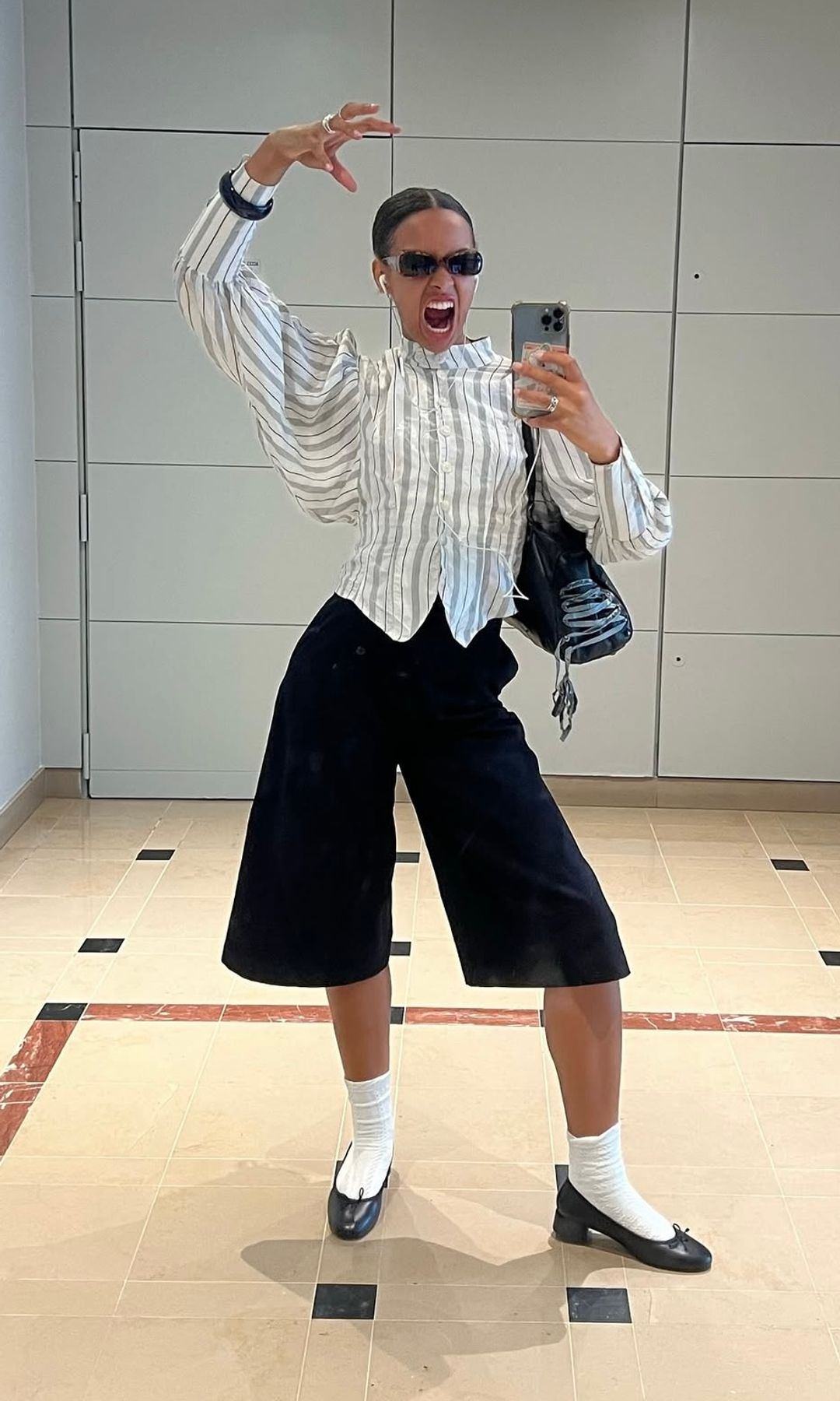 rosie oktocha wears bermuda shorts