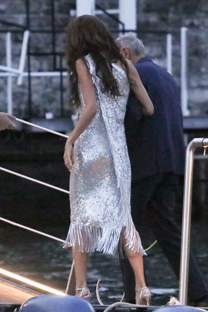 BGUK_3311600 - *EXCLUSIVE* Amal Clooney walks off the dock arm in arm with George