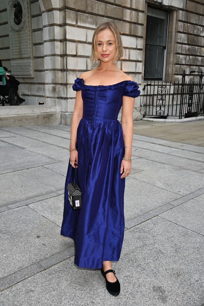 Lady Amelia Windsor outside in navy off shoulder dress