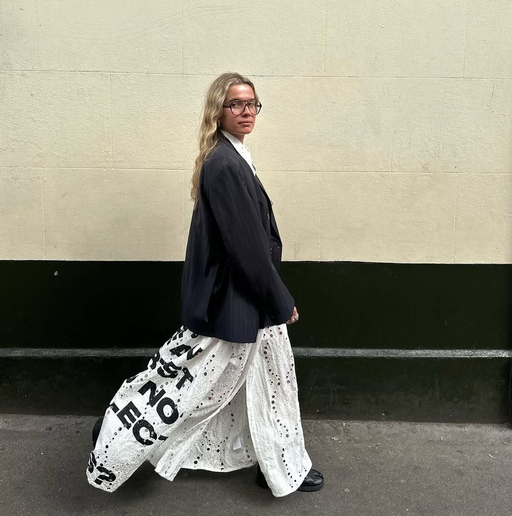 influencer in printed text skirt and blazer