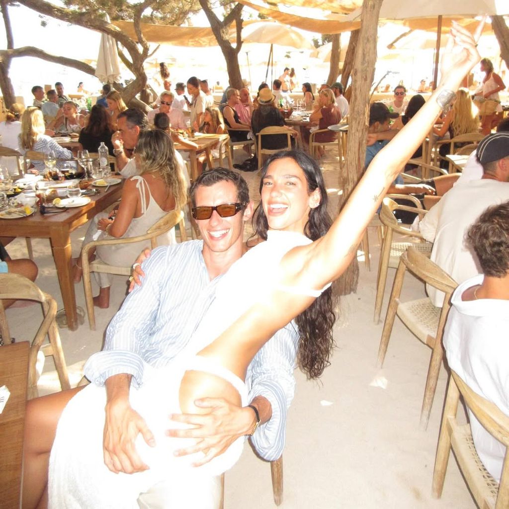Dua Lipa and Callum Turner celebrating in Ibiza