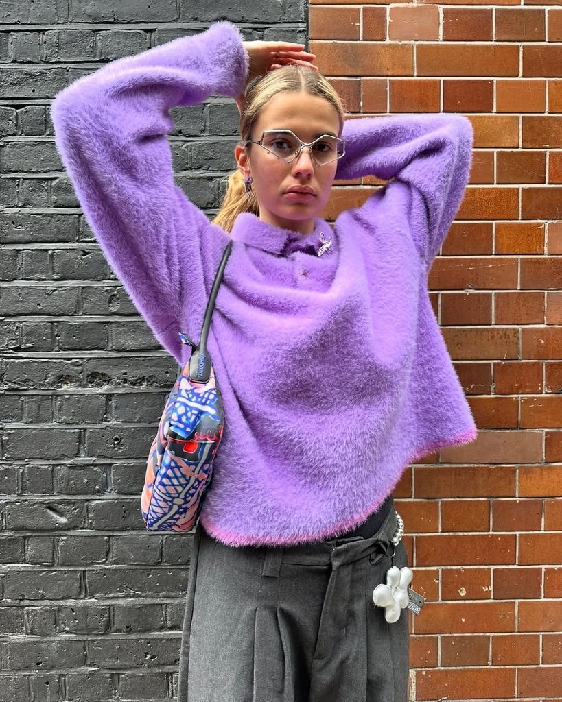 influencer in purple knit