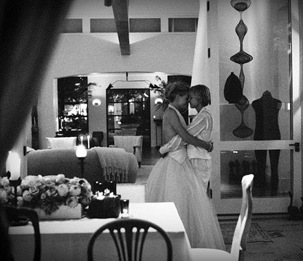 Ellen DeGeneres hugging new wife Portia in the living room of their LA home