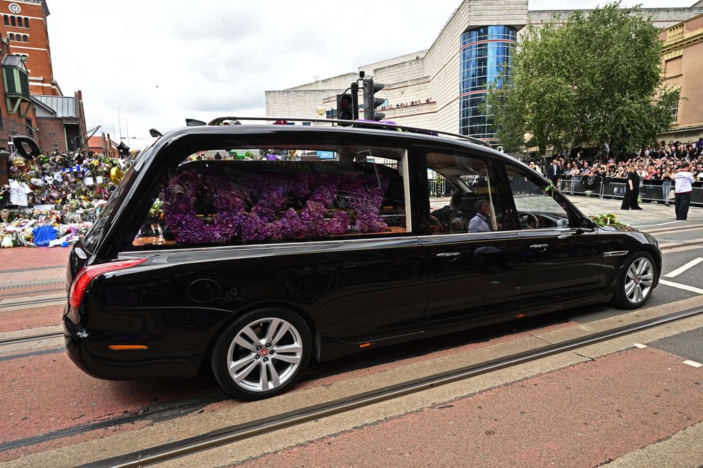 The funeral cortege for Ozzy Osbourne travels through his home city of Birmingham on July 30, 2025 in Birmingham, England. 