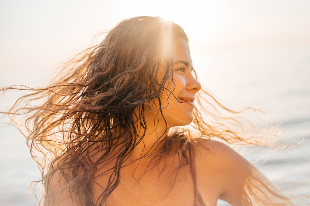 Beautiful woman portrait in sunset light.