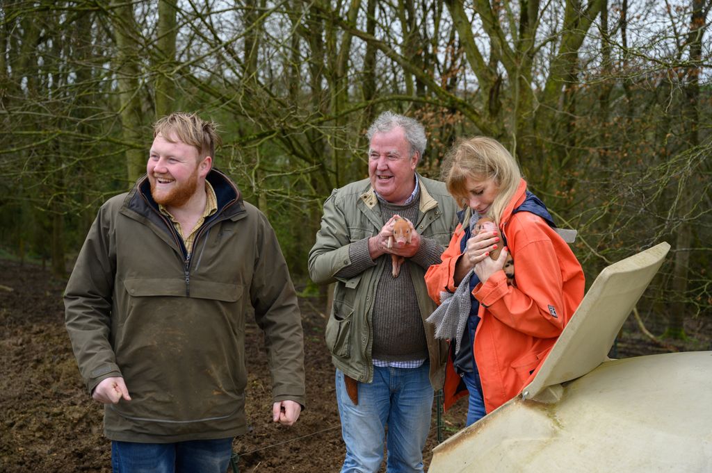 Jeremy Clarkson, Lisa and Kaleb with piglets on Diddly Squat Farm