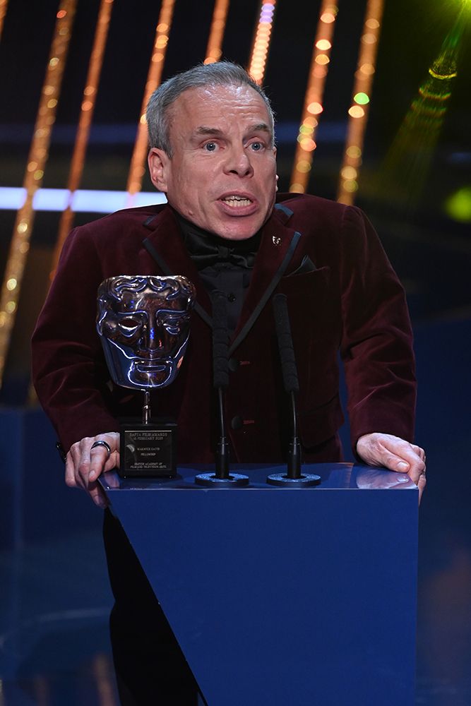 Warwick Davis on stage at the BAFTAs