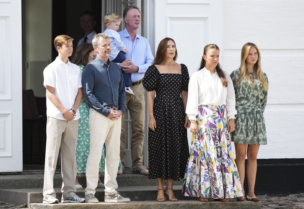Danish King Frederik X (2-L) and Queen Mary (C), with their children Prince Vincent (L), Princess Isabella (2-R) and Princess Josephine (R) watch the changing of the guard ceremony at Graasten Palace