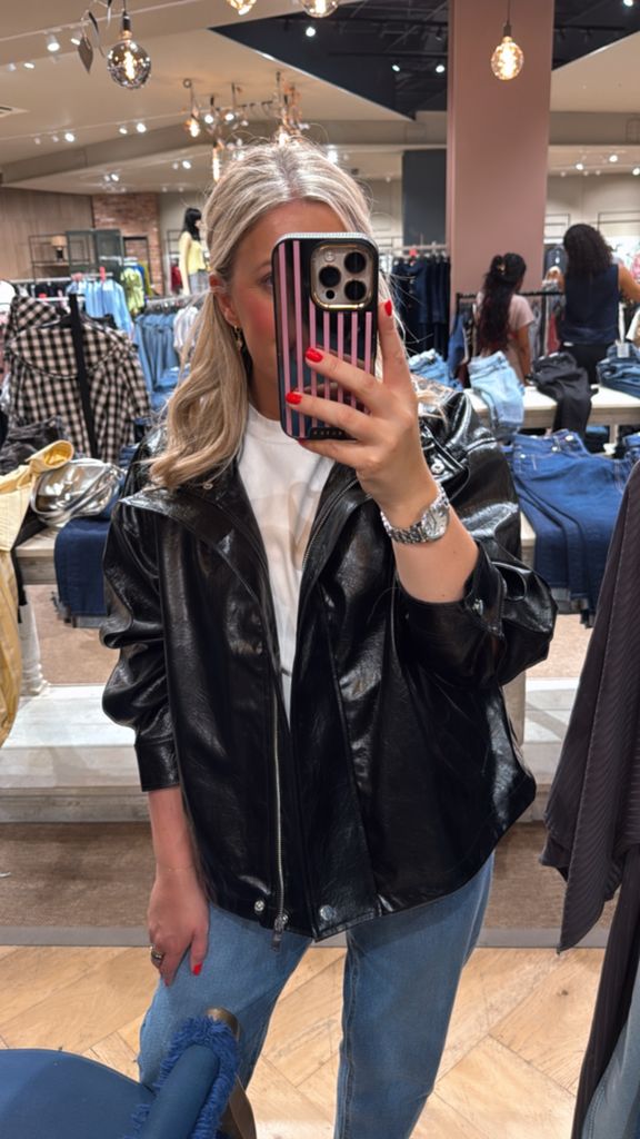 Shopping expert Leanne Bayley wearing a funnel neck leather looking bomber jacket from River Island