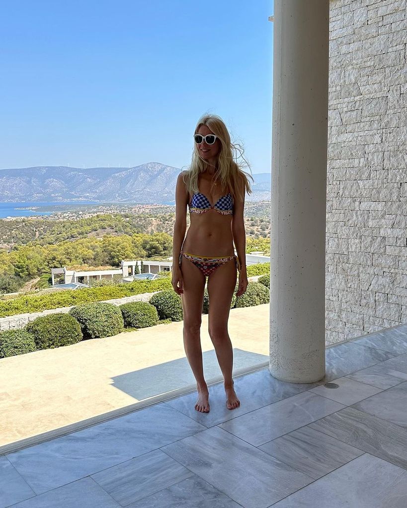 Claudia Schiffer in a blue and red bikini