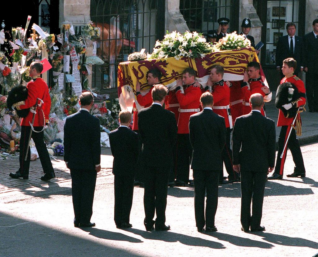 Princess Diana's coffin being carried into Westminster Abbey with Prince Charles, Prince Harry, Charles Spencer, Prince William and Prince Philip looking on