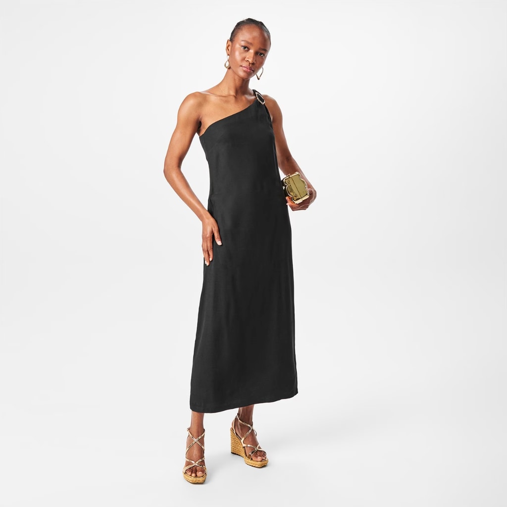 model wearing black dress with gold buckle by Edited