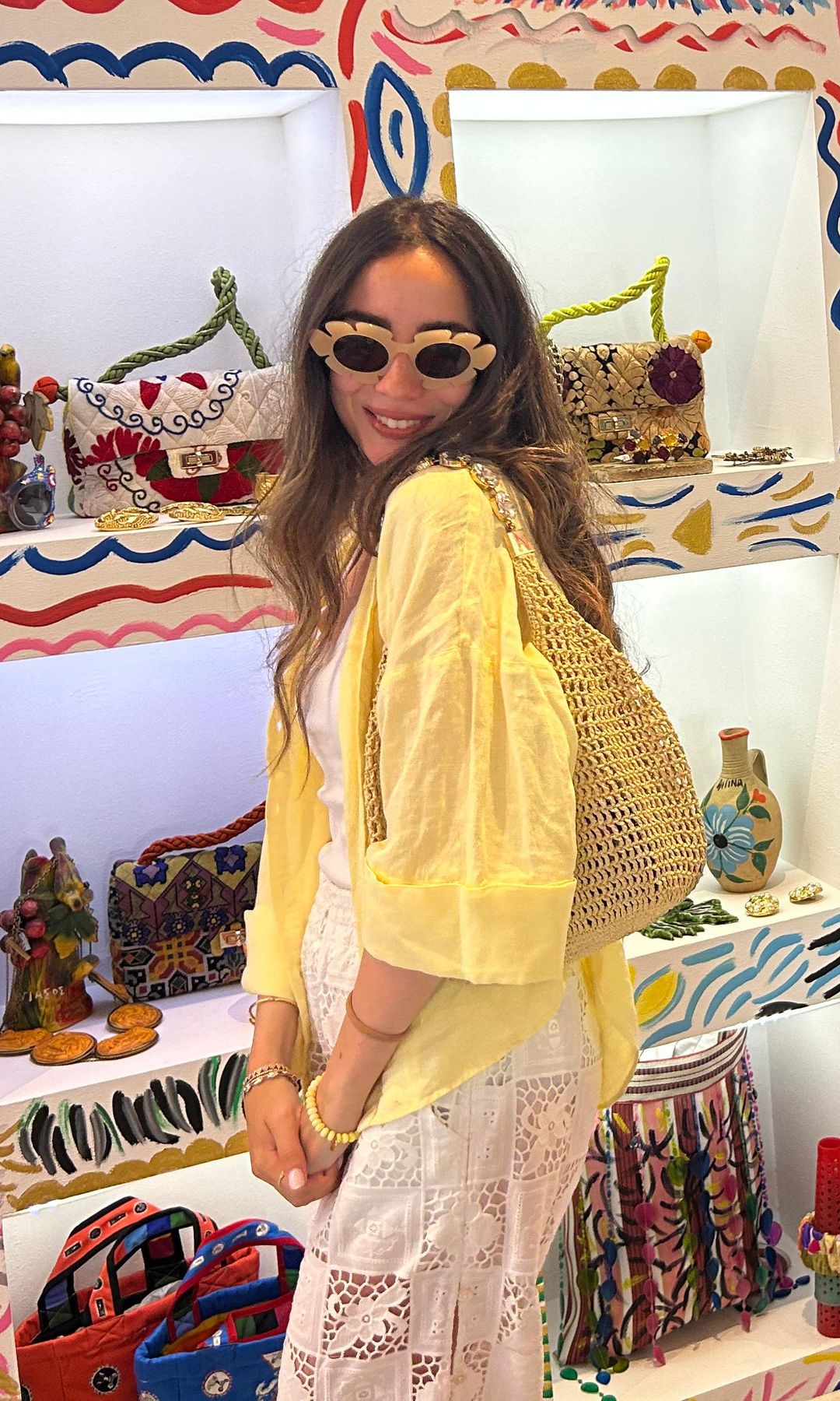 Alia Zaki in yellow cardigan