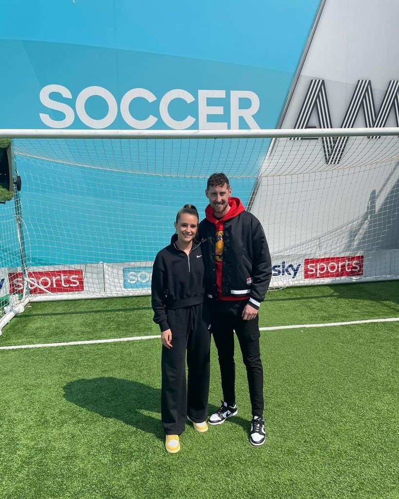 Ella Toone and her boyfriend Joe Bunney in front of a football net