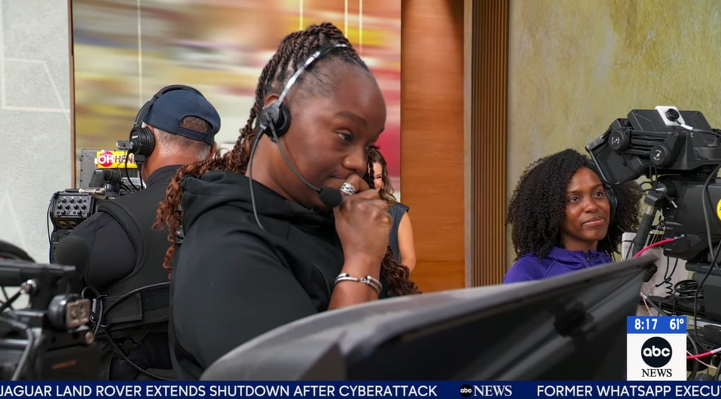 The outspoken crew-member looks sad with head mic on 