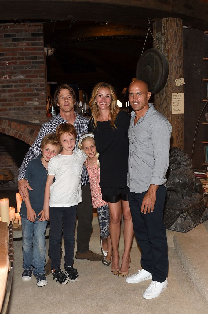 Julia Roberts, Danny Moder and kids pose with Kelly Slater