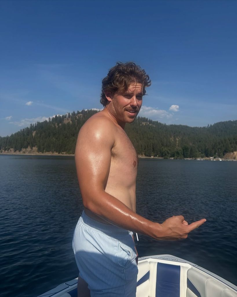 Christopher Schwarzenegger poses for a photo on the family's boat while out on the lake, shared on Instagram