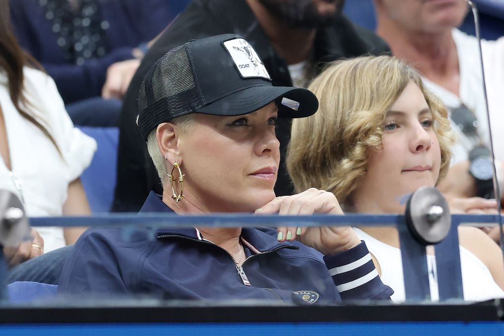 Pink and daughter Willow Sage look on at the Men's Singles Final match.