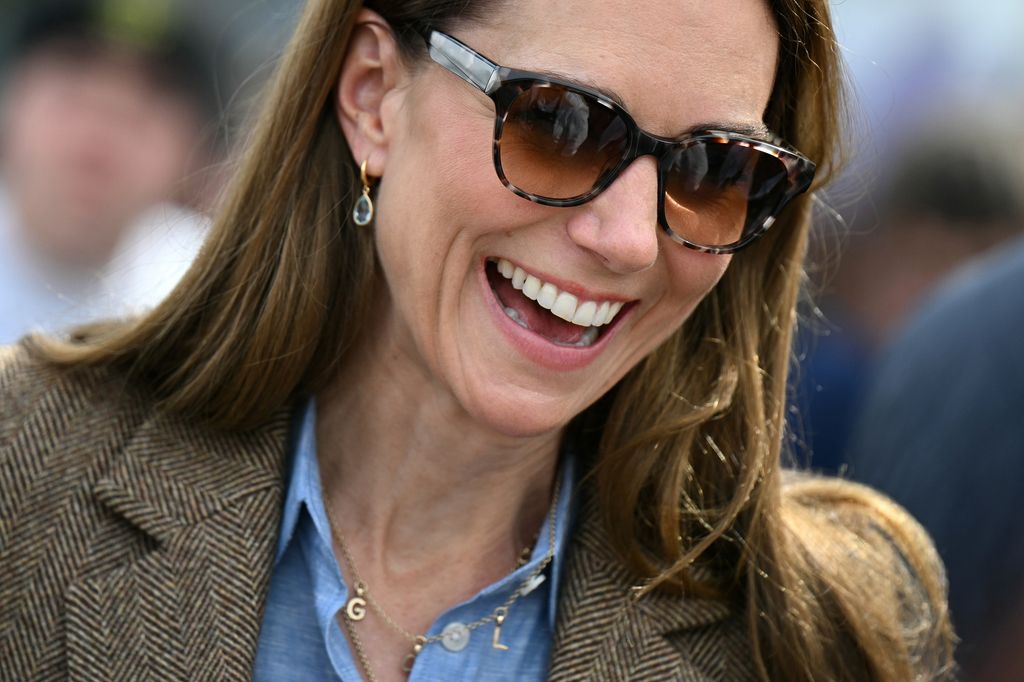 Kate Middleton wearing sunglasses and necklace with children's initials