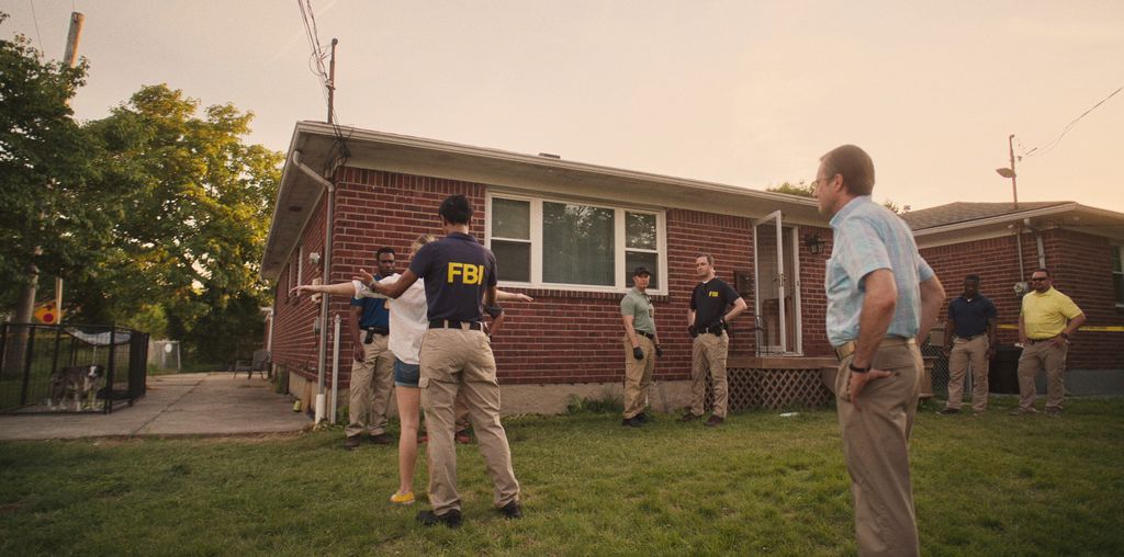 A woman in searched by FBI officers