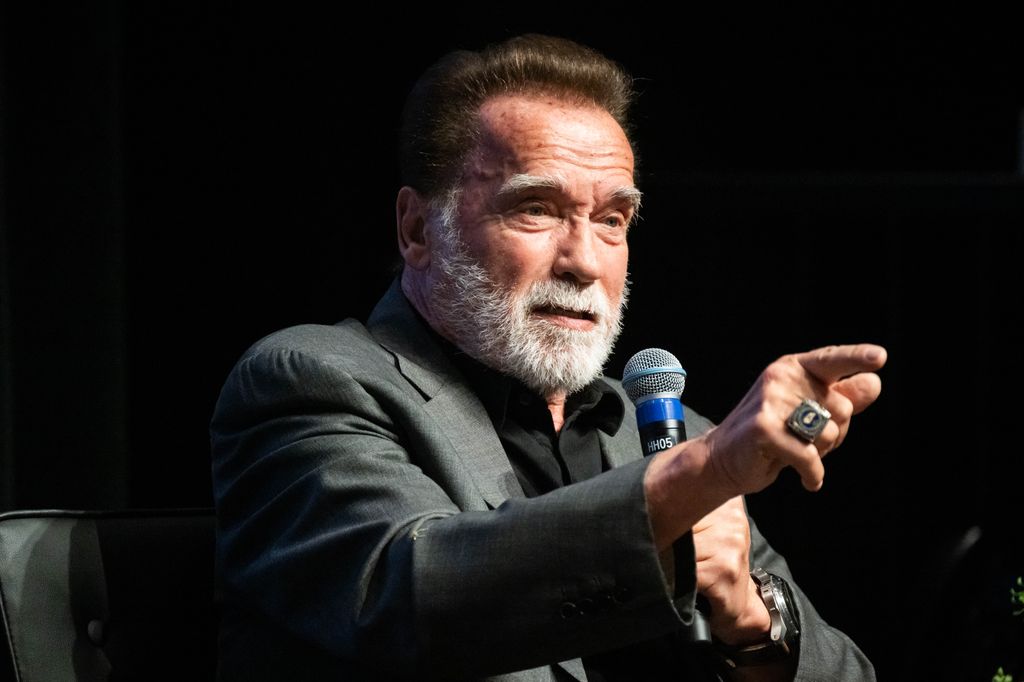 Former Gov. Arnold Schwarzenegger says using the term pollution is more relatable than talking about climate change as he speaks with Willow Bay, dean of USC Annenberg, during a three-day planet summit with the Aspen Institute at the University of Southern California
