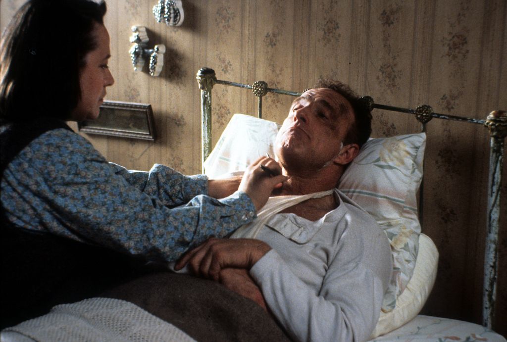 Kathy Bates watches over James Caan in a scene from the film 'Misery', 1990. (Photo by Columbia Pictures/Getty Images)