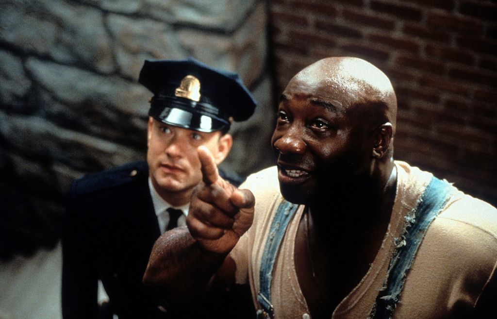 Tom Hanks is guided by Michael Clarke Duncan in a scene from the film 'The Green Mile', 1999. (Photo by Warner Brothers/Getty Images)