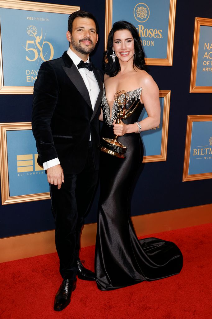 Jacqueline MacInnes Wood (R) poses with the award for "Outstanding Lead Performance In A Daytime Drama Series: Actress" with Elan Ruspolii