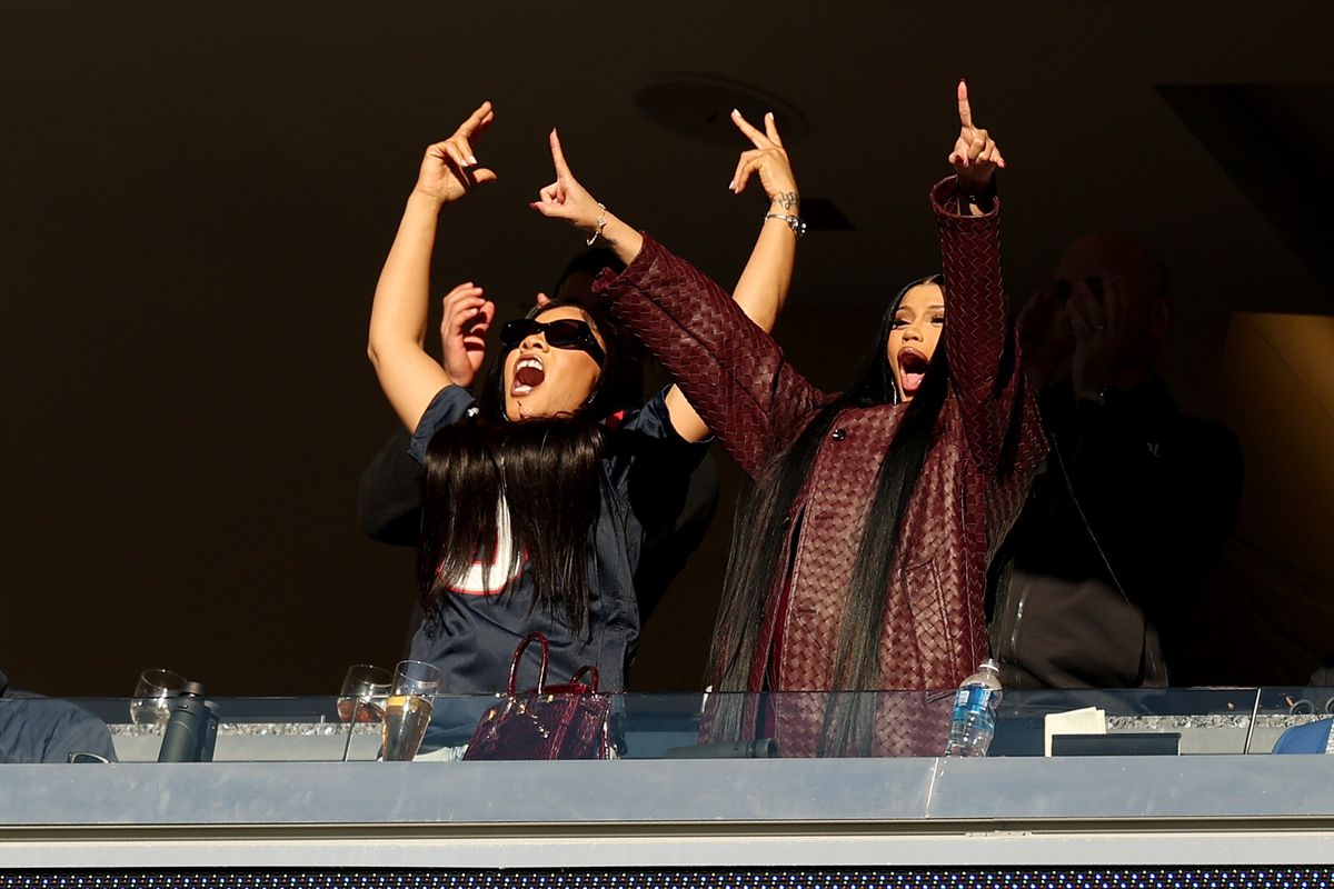  Cardi B cheers during the game between the Atlanta Falcons and the New England Patriots.
