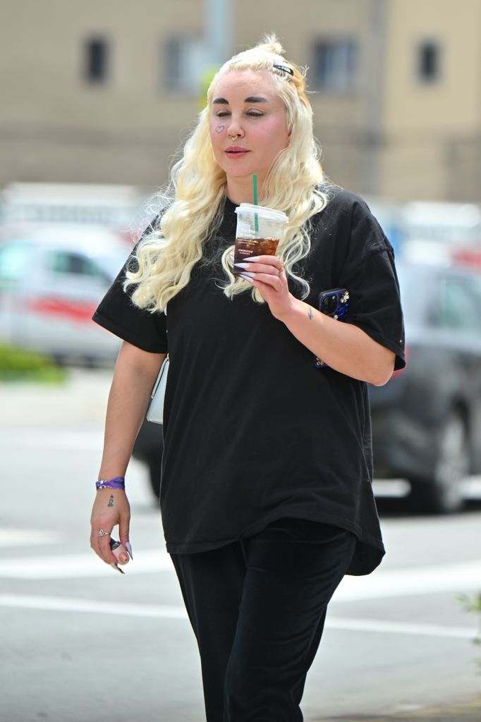 Amanda Bynes is seen out and about on April 25, 2024 in Los Angeles, California sipping an iced latte