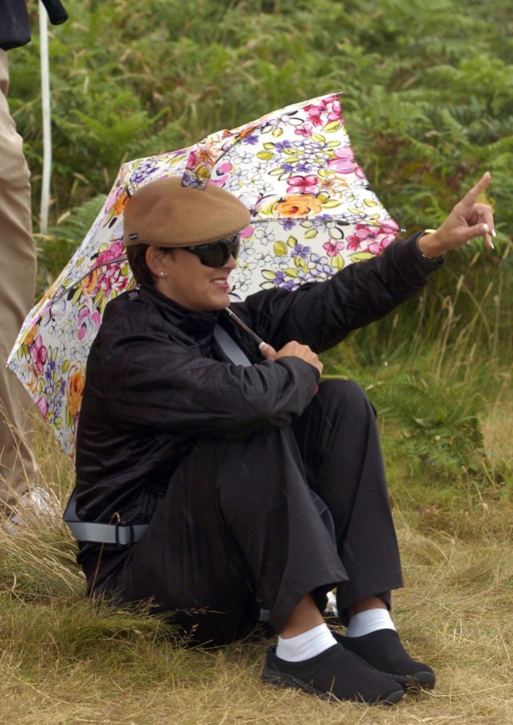 Diane Zoeller, wife of Fuzzy braves the rain at the 3rd green during the Senior British Open at Turnberry. (Photo by Chris Clark - PA Images/PA Images via Getty Images)