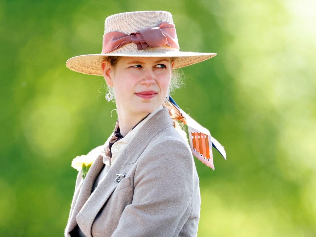 Lady Louise Windsor looking over her shoulder in a straw hat