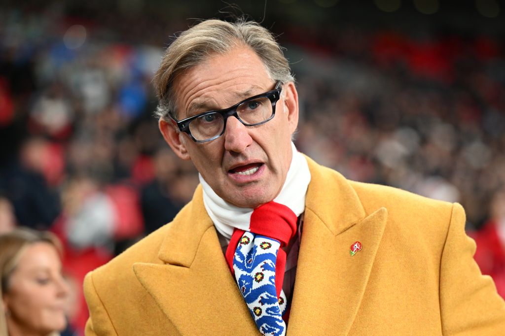Retired footballer Tony Adams in mustard yellow coat