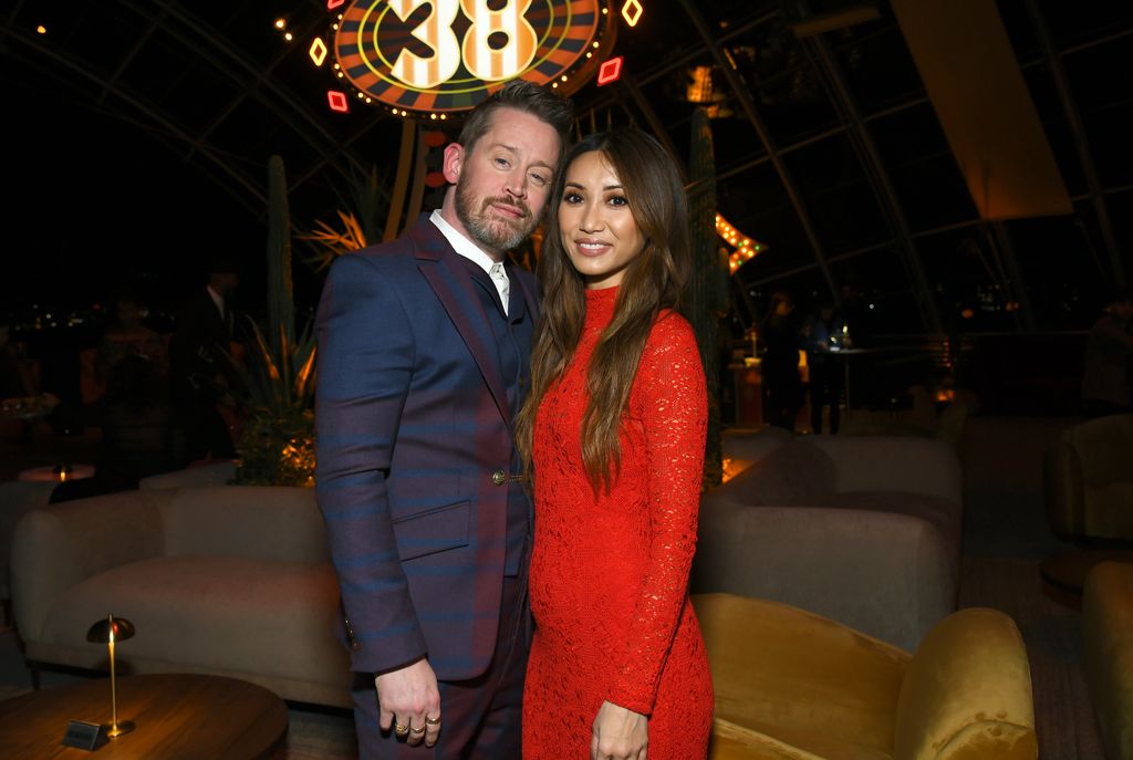 Macaulay with Brenda Song at the after party 