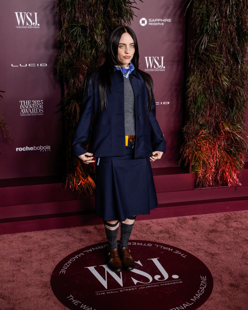 Billie Eilish in navy jacket and skirt attends the WSJ. Magazine 2025 Innovator Awards at MoMA