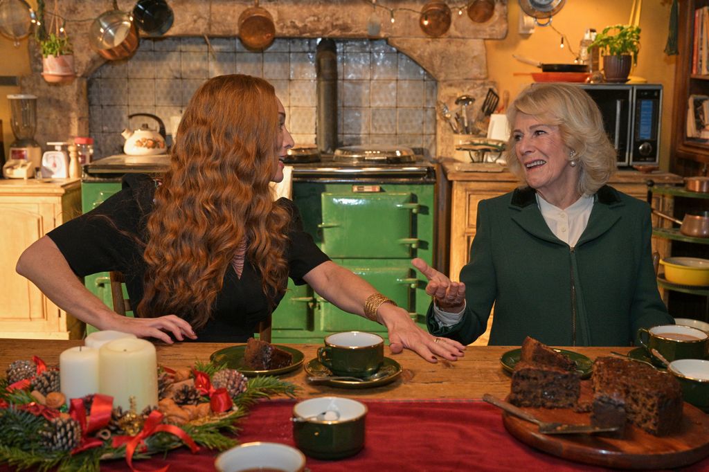Queen Camilla gestures as she speaks to actor Victoria Smurfit 