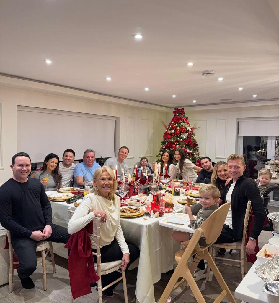 The Wrights smiling at dinner table