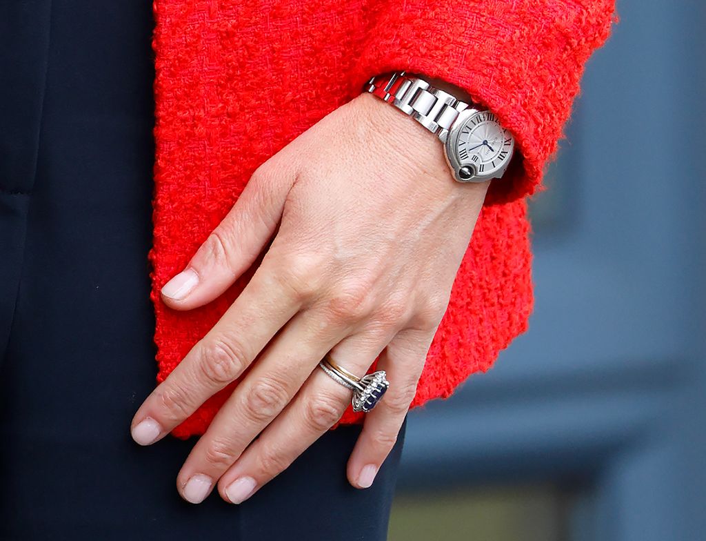 Kate Middleton, Princess of Wales wears a red blazer in Sittingbourne, England. 