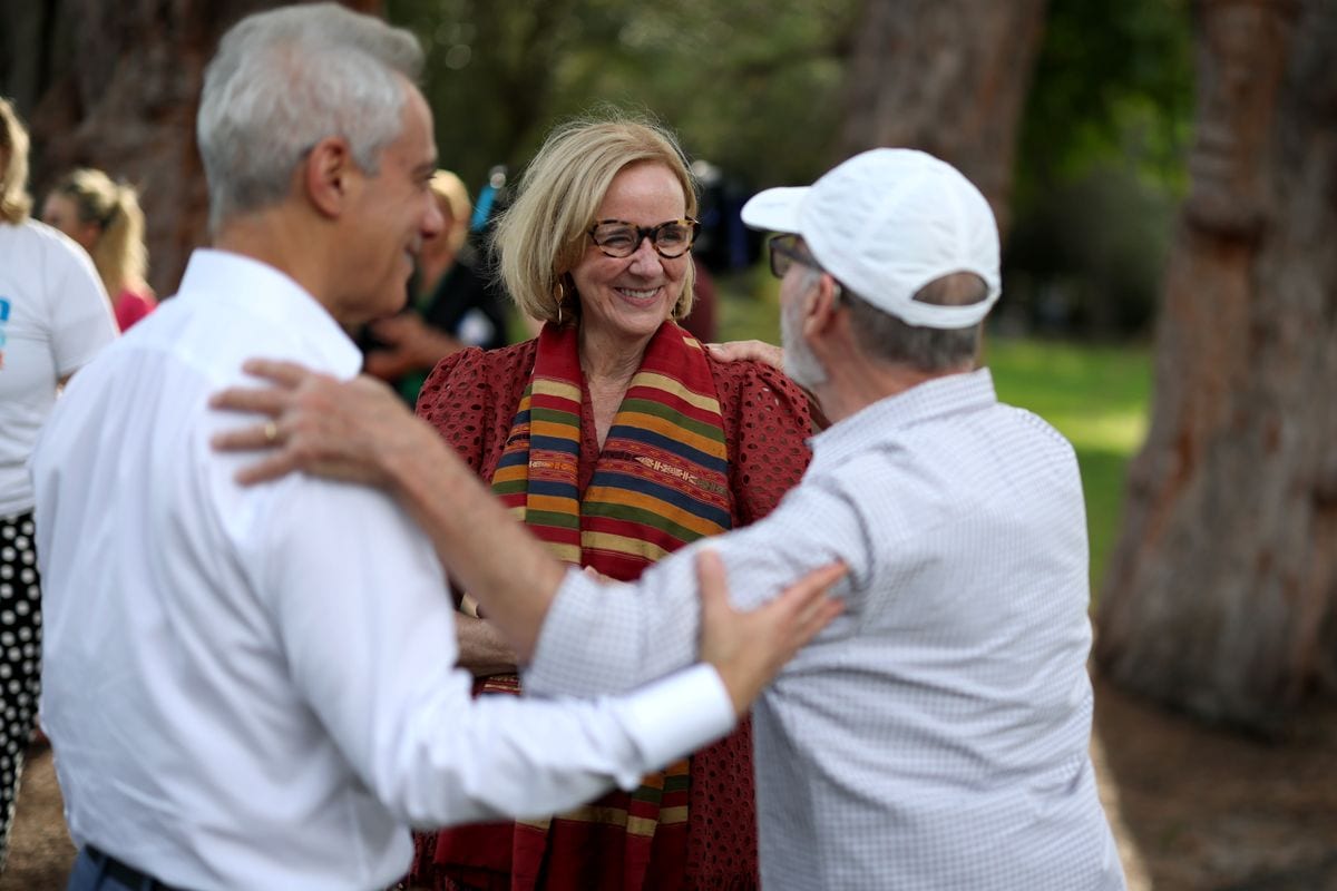 City of Miami Mayor Eileen Higgins (C), former Chicago Mayor and Ambassador to Japan Rahm Emanuel, and Raul Hernandez, (R) greet each other before she canvasses a neighborhood for votes.
