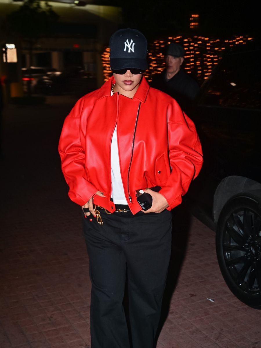 The cap softened the boldness of the leather jacket, making the look feel lived in rather than staged. 