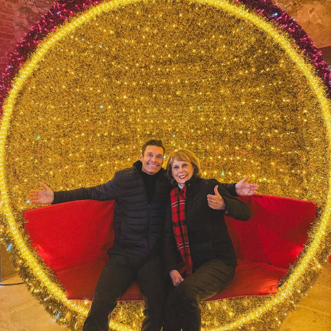 Ryan Seacrest and his mother Connie Seacrest sit inside an ornamental display, shared on Instagram