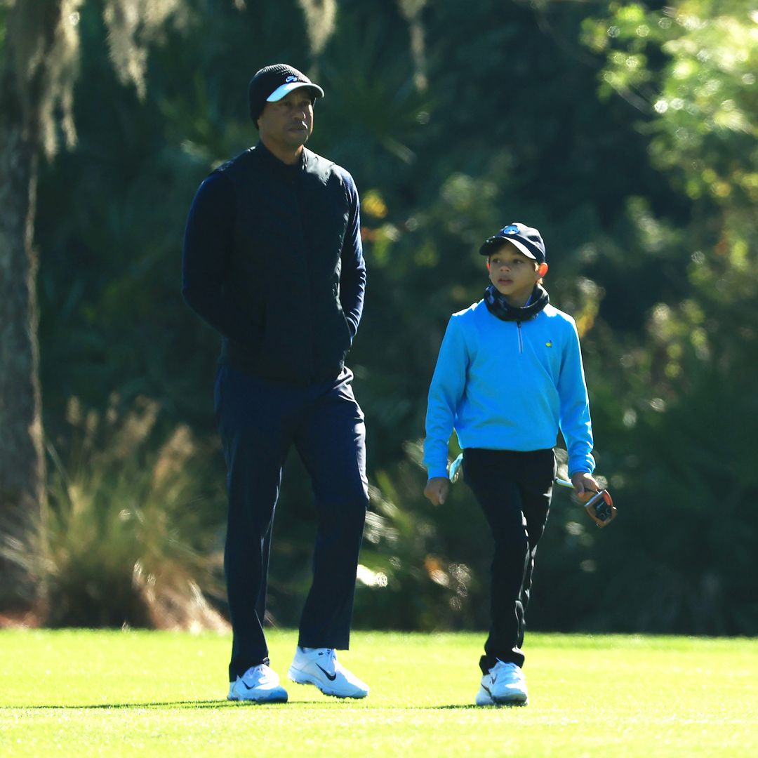 Tiger Woods of the United States and Charlie Woods walk on the seventh hole during the pro-am prior to the PNC Championship at the Ritz-Carlton Golf Club Orlando on December 18, 2020 in Orlando, Florida.