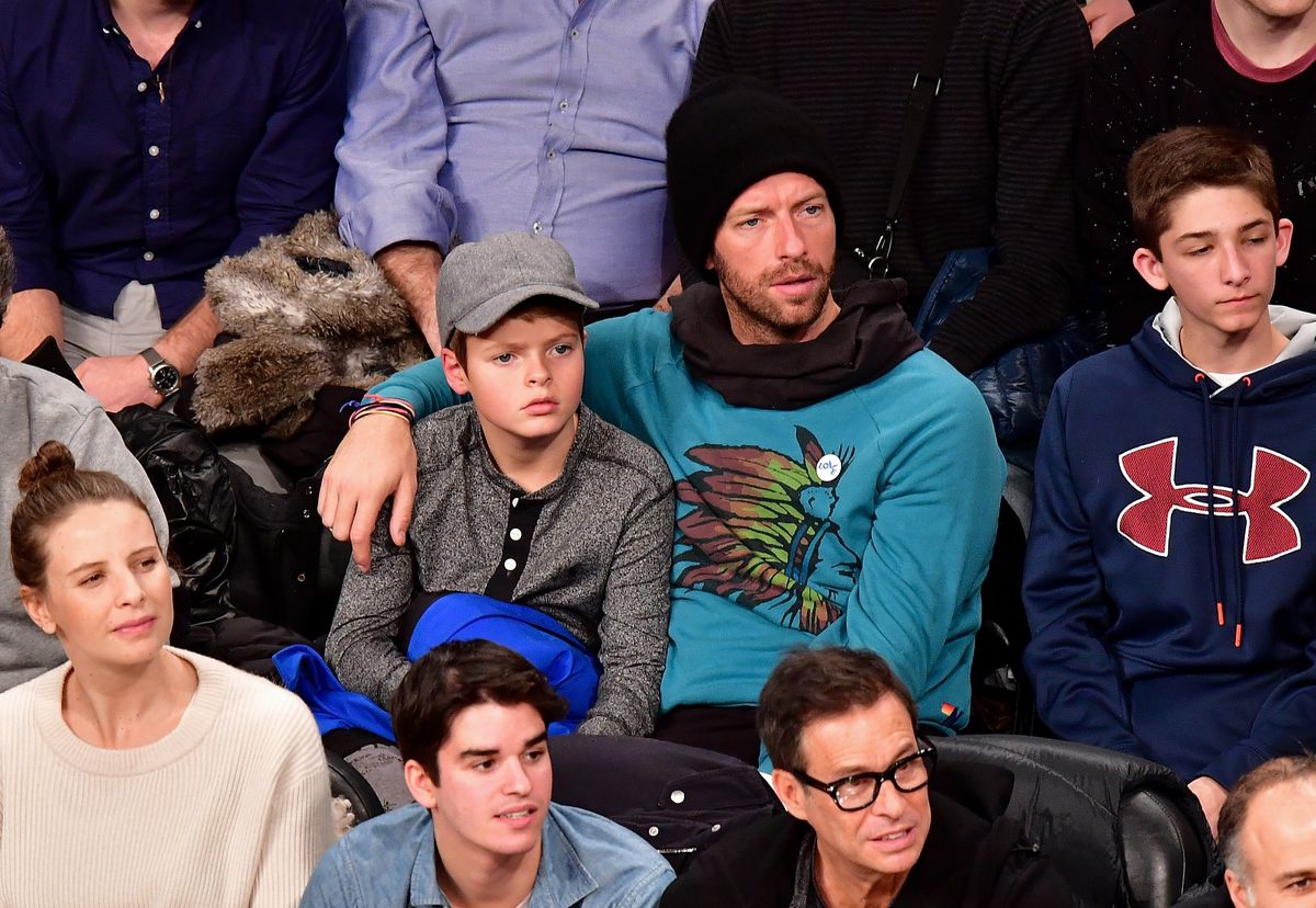 NEW YORK, NY - DECEMBER 22:  Chris Martin and son Moses Martin attend Golden State Warriors Vs. Brooklyn Nets game at Barclays Center on December 22, 2016 in New York City.  (Photo by James Devaney/GC Images) 