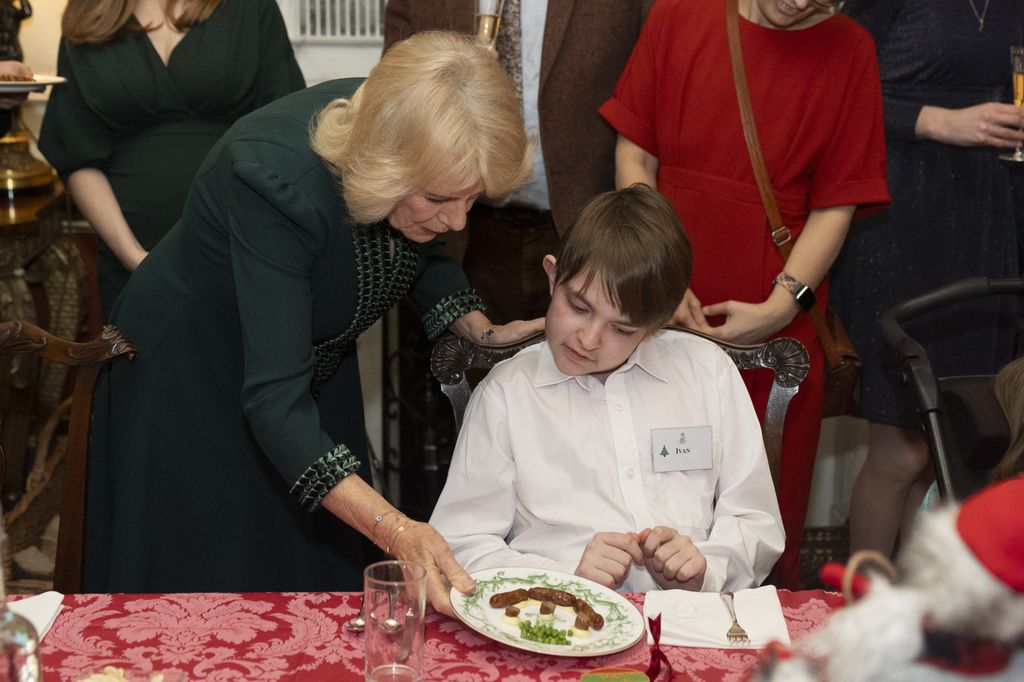 Queen Camilla serves Christmas lunch to kids