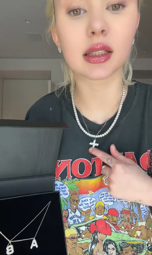 Alabama Barker shows off new Cross necklace