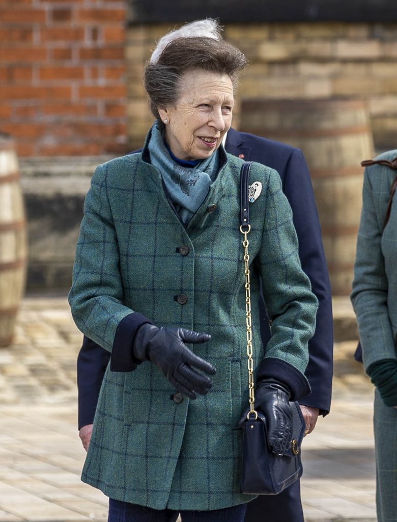 Princess Anne wearing green outfit and loveheart brooch